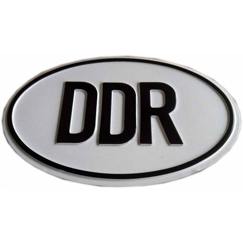 owalna tabliczka, elipsa, białe tło, czarny napis DDR